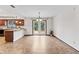 Dining area with a view of the kitchen, access to the backyard through glass doors and tile floors at 7426 N Carroll Rd, Indianapolis, IN 46236
