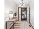 Bright entryway with tile floors, a decorative console table, and a clear view of the outdoors, creating a welcoming first impression at 7426 N Carroll Rd, Indianapolis, IN 46236