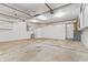 A large garage with storage cabinets and a clean concrete floor at 7426 N Carroll Rd, Indianapolis, IN 46236