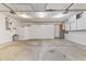 A large garage with storage cabinets and a clean concrete floor at 7426 N Carroll Rd, Indianapolis, IN 46236