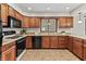 A kitchen showcases wood cabinets and stainless steel appliances at 7426 N Carroll Rd, Indianapolis, IN 46236