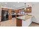 Updated kitchen with granite countertops, wood cabinets, and modern appliances at 7426 N Carroll Rd, Indianapolis, IN 46236