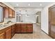 A corner kitchen features wood cabinets and stainless steel appliances at 7426 N Carroll Rd, Indianapolis, IN 46236