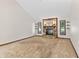 Spacious living room with a stone fireplace, windows, high ceilings and neutral carpet at 7426 N Carroll Rd, Indianapolis, IN 46236