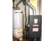Water heater and furnace in the basement at 7443 Country Brook Dr, Indianapolis, IN 46260