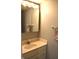 Bathroom featuring a single sink vanity with a mirror and neutral walls at 7443 Country Brook Dr, Indianapolis, IN 46260