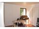 Bright bedroom featuring a window, hardwood floors, and plenty of space for furnishings at 7443 Country Brook Dr, Indianapolis, IN 46260