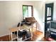 Bedroom with hardwood floors, a window with nature view, a desk and rolltop desk at 7443 Country Brook Dr, Indianapolis, IN 46260