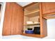 Wood cabinet with shelving and dishware at 7443 Country Brook Dr, Indianapolis, IN 46260