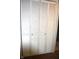 White louvered closet doors in a bedroom or hallway provide storage and classic style at 7443 Country Brook Dr, Indianapolis, IN 46260