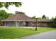 The community clubhouse is surrounded by a lush green lawn at 7443 Country Brook Dr, Indianapolis, IN 46260
