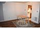 Dining area with table, chairs, and hardwood floors, adjacent to kitchen at 7443 Country Brook Dr, Indianapolis, IN 46260
