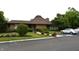 Well-maintained building exterior with a nicely landscaped yard, mature landscaping, and on-site parking at 7443 Country Brook Dr, Indianapolis, IN 46260