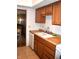 Well-lit kitchen features plenty of cabinet space and tiled floors at 7443 Country Brook Dr, Indianapolis, IN 46260