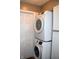 Efficient laundry area showcasing stacked washer and dryer units, maximizing space at 7443 Country Brook Dr, Indianapolis, IN 46260