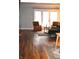 Comfortable living room with hardwood floors, a fireplace, and a sitting area at 7443 Country Brook Dr, Indianapolis, IN 46260