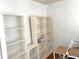 Home office features built-in bookshelves, a desk, and plenty of natural light at 7443 Country Brook Dr, Indianapolis, IN 46260