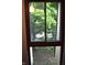 Bright window view of lush trees and greenery, bringing the beauty of nature indoors at 7443 Country Brook Dr, Indianapolis, IN 46260