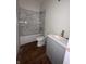 Renovated bathroom featuring marble tile, new vanity, and fixtures at 830 Villa Ave, Indianapolis, IN 46203