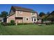 A well-maintained backyard with a lawn, deck, and landscaping, creating an inviting outdoor space at 8331 Tequista Ct, Indianapolis, IN 46236
