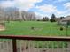 Expansive backyard view from a deck, showcasing the large green space and surrounding trees at 8331 Tequista Ct, Indianapolis, IN 46236