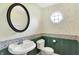 Charming half bathroom featuring a unique decorative scheme and traditional fixtures at 8331 Tequista Ct, Indianapolis, IN 46236