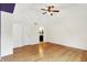 Bright bedroom with hardwood floors, a ceiling fan, and ensuite access at 8331 Tequista Ct, Indianapolis, IN 46236