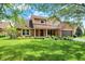 Beautiful two-story home featuring brick and siding, a manicured lawn, and an attached garage at 8331 Tequista Ct, Indianapolis, IN 46236