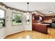 Eat-in kitchen with natural light, dark wood cabinets and stainless steel appliances at 8331 Tequista Ct, Indianapolis, IN 46236