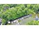 Aerial view of a marina surrounded by lush greenery, with boats docked along the pier at 8331 Tequista Ct, Indianapolis, IN 46236