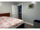 Bedroom featuring a queen bed and connecting view to dining room at 8373 W State Road 47, Thorntown, IN 46071