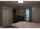 This bedroom boasts natural light from a window and ample storage with a closet and built in shelving at 8373 W State Road 47, Thorntown, IN 46071