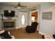 Inviting living room with fireplace, plush carpeting, large picture window and entry to the dining room at 8373 W State Road 47, Thorntown, IN 46071