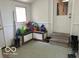 Mudroom features a built-in bench, a patterned rug, and access to an exterior door with steps at 8373 W State Road 47, Thorntown, IN 46071