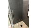 Modern shower featuring sleek black tile, glass door, and shower caddy at 8373 W State Road 47, Thorntown, IN 46071