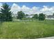 Backyard featuring lush green grass, a fence, and a view of the neighborhood at 842 Westpointe Dr, Shelbyville, IN 46176