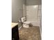 Bathroom featuring neutral color palette, tile floor, and toilet at 842 Westpointe Dr, Shelbyville, IN 46176