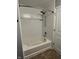 Modern bathtub featuring updated shower fixtures and sleek tile surround at 842 Westpointe Dr, Shelbyville, IN 46176