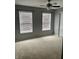 Bedroom with neutral carpet and ceiling fan and a set of windows with blinds at 842 Westpointe Dr, Shelbyville, IN 46176