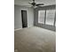 Bedroom featuring plush carpeting, ceiling fan and large windows providing natural light at 842 Westpointe Dr, Shelbyville, IN 46176