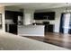 Modern kitchen featuring dark cabinetry, granite countertops, stainless appliances and open-concept design at 842 Westpointe Dr, Shelbyville, IN 46176