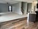 Open-concept living room next to an eat-in kitchen and featuring modern finishes and a staircase to the second floor at 842 Westpointe Dr, Shelbyville, IN 46176