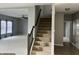 Spacious staircase view of living room with plush carpet and blue curtains at 842 Westpointe Dr, Shelbyville, IN 46176