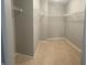 Spacious walk-in closet with ample storage solutions and neutral carpet flooring at 842 Westpointe Dr, Shelbyville, IN 46176