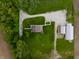 Aerial view of a charming home with a well-maintained yard and a detached garage at 8468 S County Road 575 E, Mooresville, IN 46158