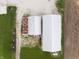 An aerial view showing a large building with updated white roof next to an older building at 8468 S County Road 575 E, Mooresville, IN 46158