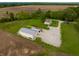 Expansive property featuring a charming home, large outbuilding, and sprawling fields at 8468 S County Road 575 E, Mooresville, IN 46158