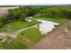 Aerial view of a home with a garage and a meticulously maintained lawn at 8468 S County Road 575 E, Mooresville, IN 46158