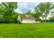 Picturesque property with lush green lawn, play equipment and charming home at 8468 S County Road 575 E, Mooresville, IN 46158