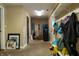 Unfinished basement area for storage featuring white shelving and a door to the outside at 8468 S County Road 575 E, Mooresville, IN 46158